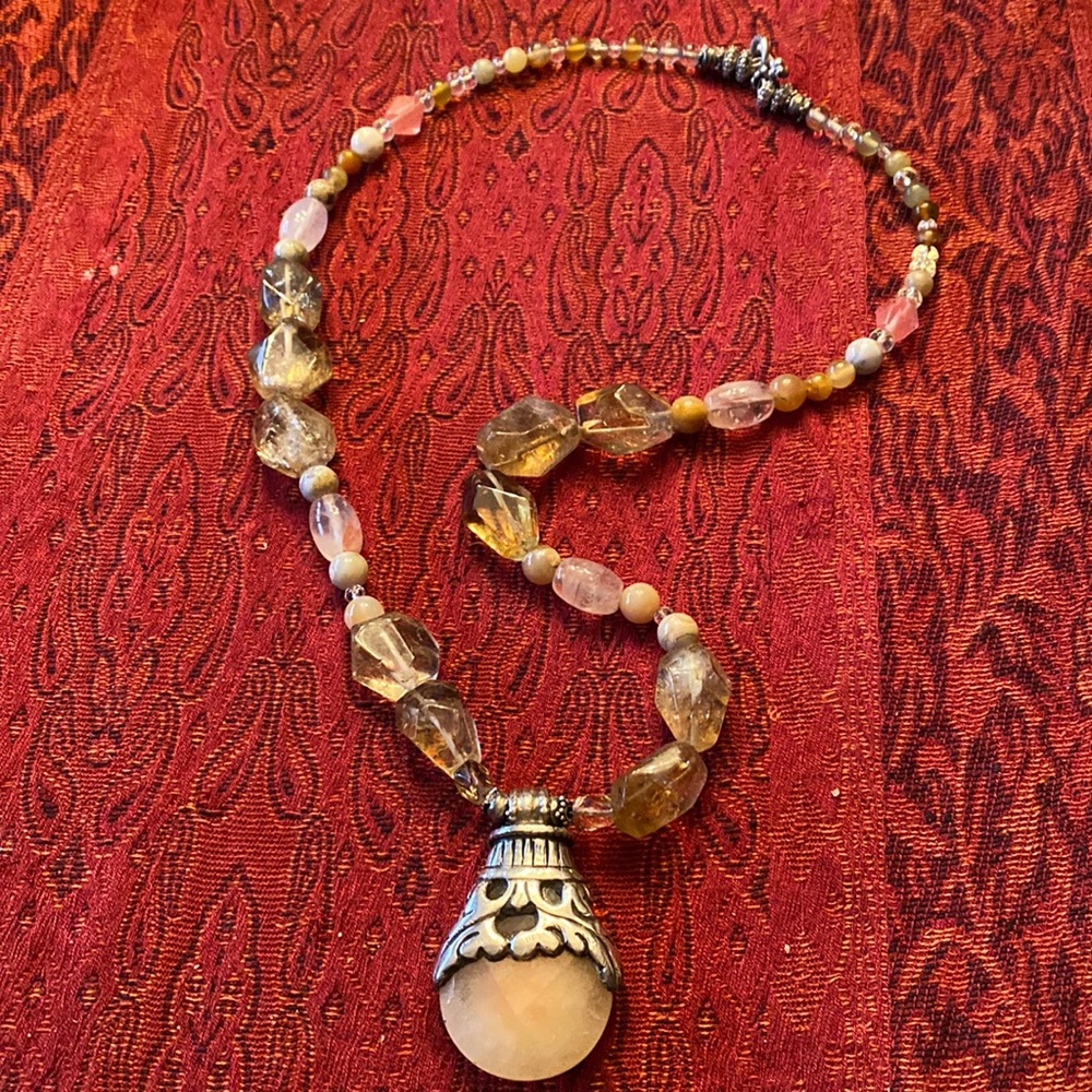 Pink quartz and silver pendant with semi precious stones.